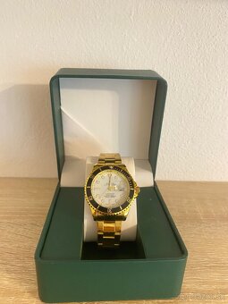 Rolex Submariner - yellow gold, white dial - 5