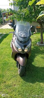 Sym Maxim 600 - 5
