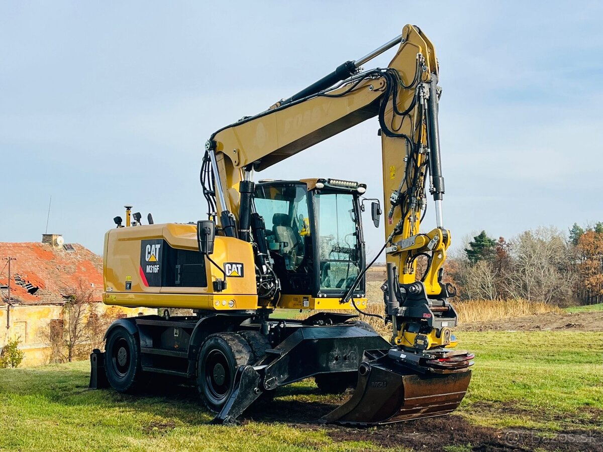 Kolesové rypadlo Caterpillar M316F - 6