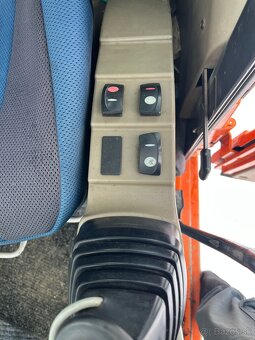 Kolesové rypadlo CASE WX145 - 7