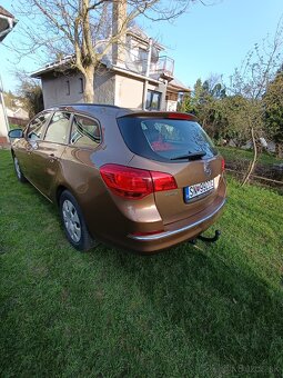 Opel Astra st j - 7
