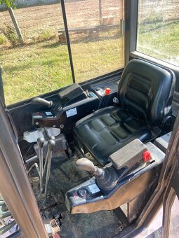 Mini bager Bobcat 320 - 7