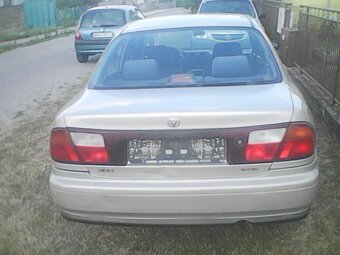 Mazda 323 1,5 benzin 65 KW - 7