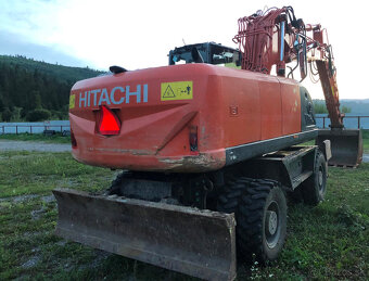 Kolesový báger Hitachi ZX210 - 7