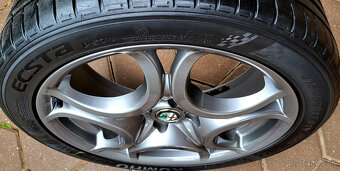 alu R17 4x100, orig. Alfa Romeo MITO, pneu 215/45 - 8