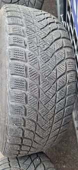 Predám zimný komplet na audi. - 8