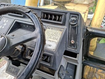 CATERPILLAR 428B 4X4 - 8