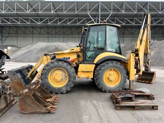KOMATSU WB975 4X4 - 8