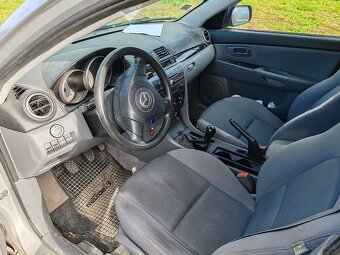 Mazda 3 1.4 benzín  62kw - 8