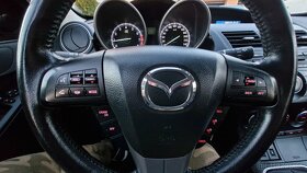 Mazda 3.   2,0 - 8