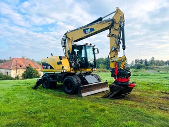 Kolesové rypadlo Caterpillar M315D - 8