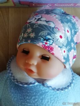 Realisticka babika s oblecenim - 9