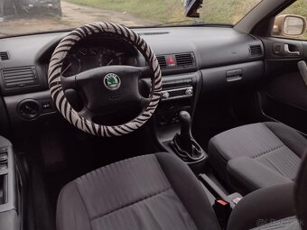 Predám Škoda Octavia 1.6i SR Elegance M5 5d S klímou - 9